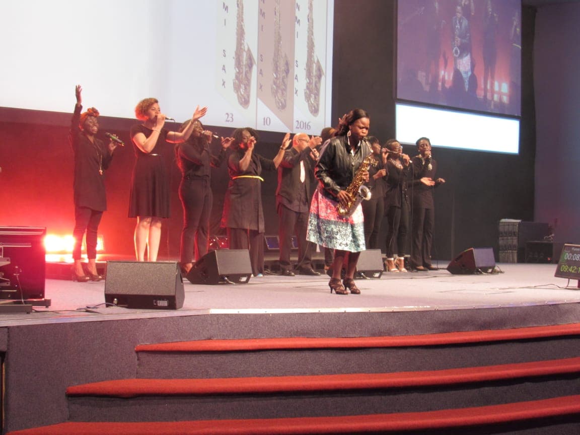Funmisax performing on stage at the London Festival of Life Concert, October 2016