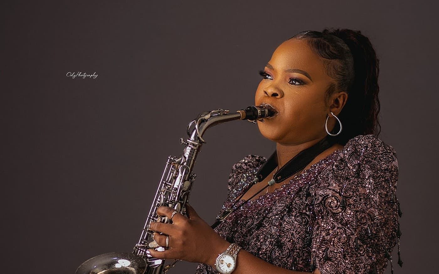 Funmisax playing the saxophone